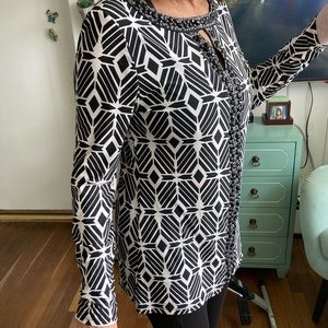 Very attractive pull over fashionable, comfortable lightweight blouse.